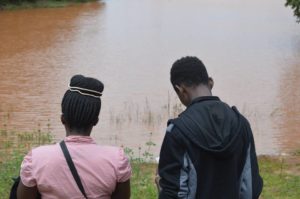 One of the team mapping an earth dam