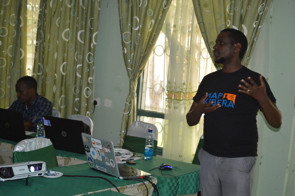 Zack Wambua from Map Kibera introducing the team to mapping using OpenStreetMap