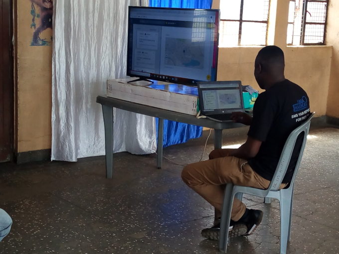 Joshua doing a live demo of how the Kenya Covid Tracker platform works