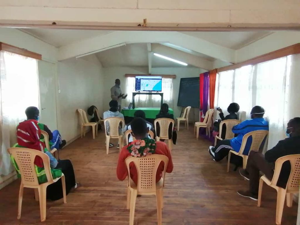 Joshua introducing the project to the team from different organizations in Kibera