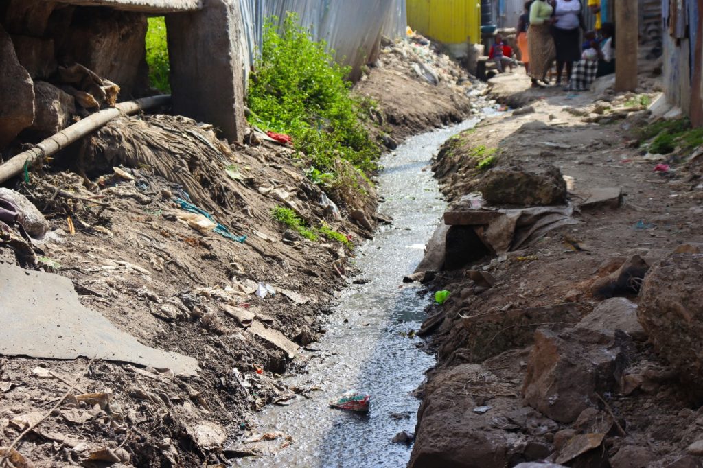 One of the many open drainages crisscrossing the area and offsetting waste into the nearby river. 